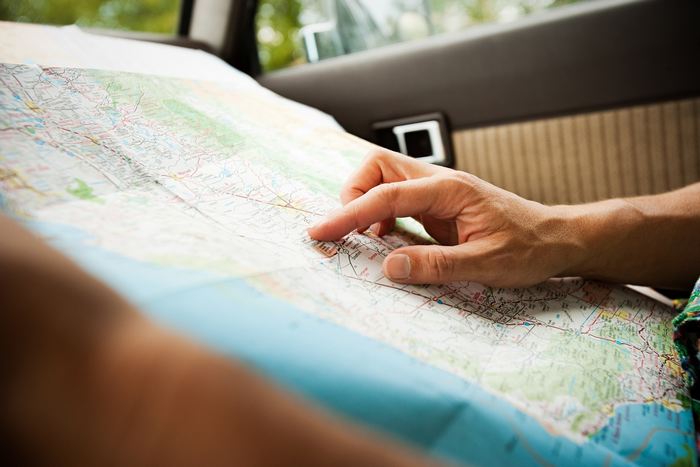 Person with a map / Sources Getty Images