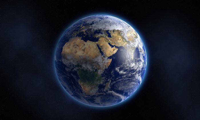 Glowing Earth floating in space / Source Getty image