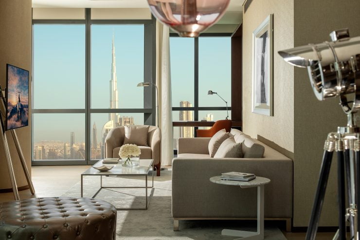 premiere suite living room downtown view 02 web e1649683183500
