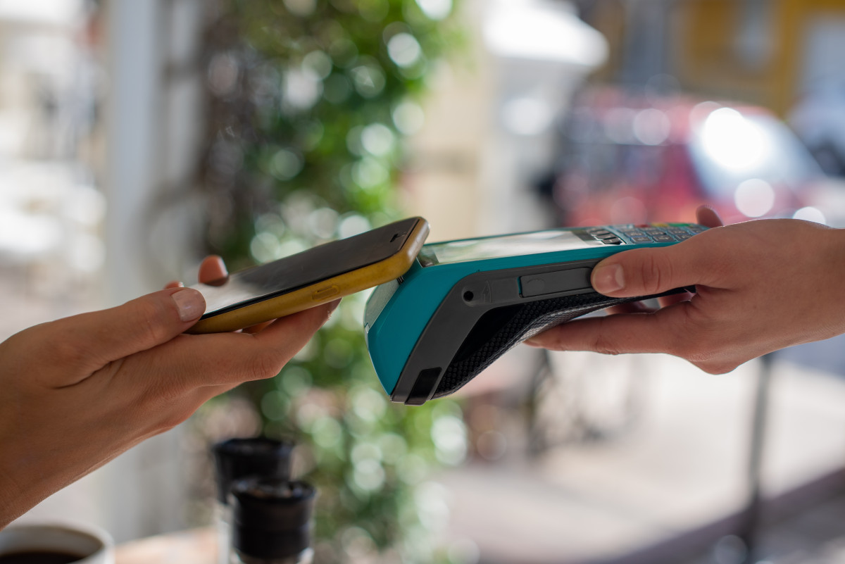 close up shot of person making a payment with mobi 2023 11 27 05 35 54 utc